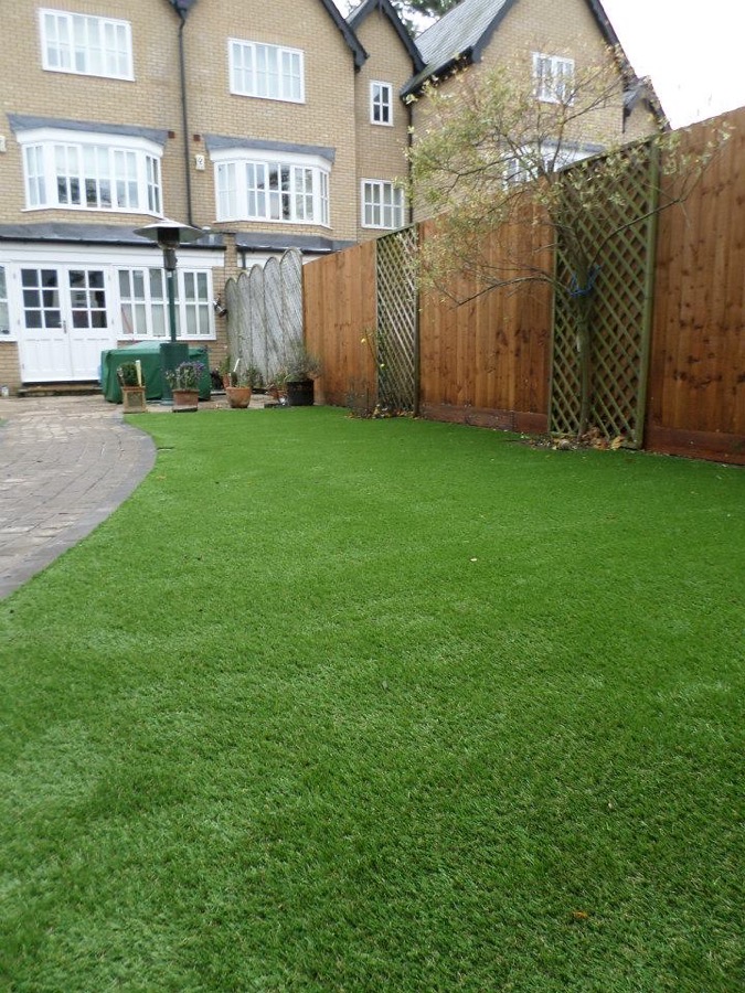 Residential artificial grass lawn after a deep cleaning